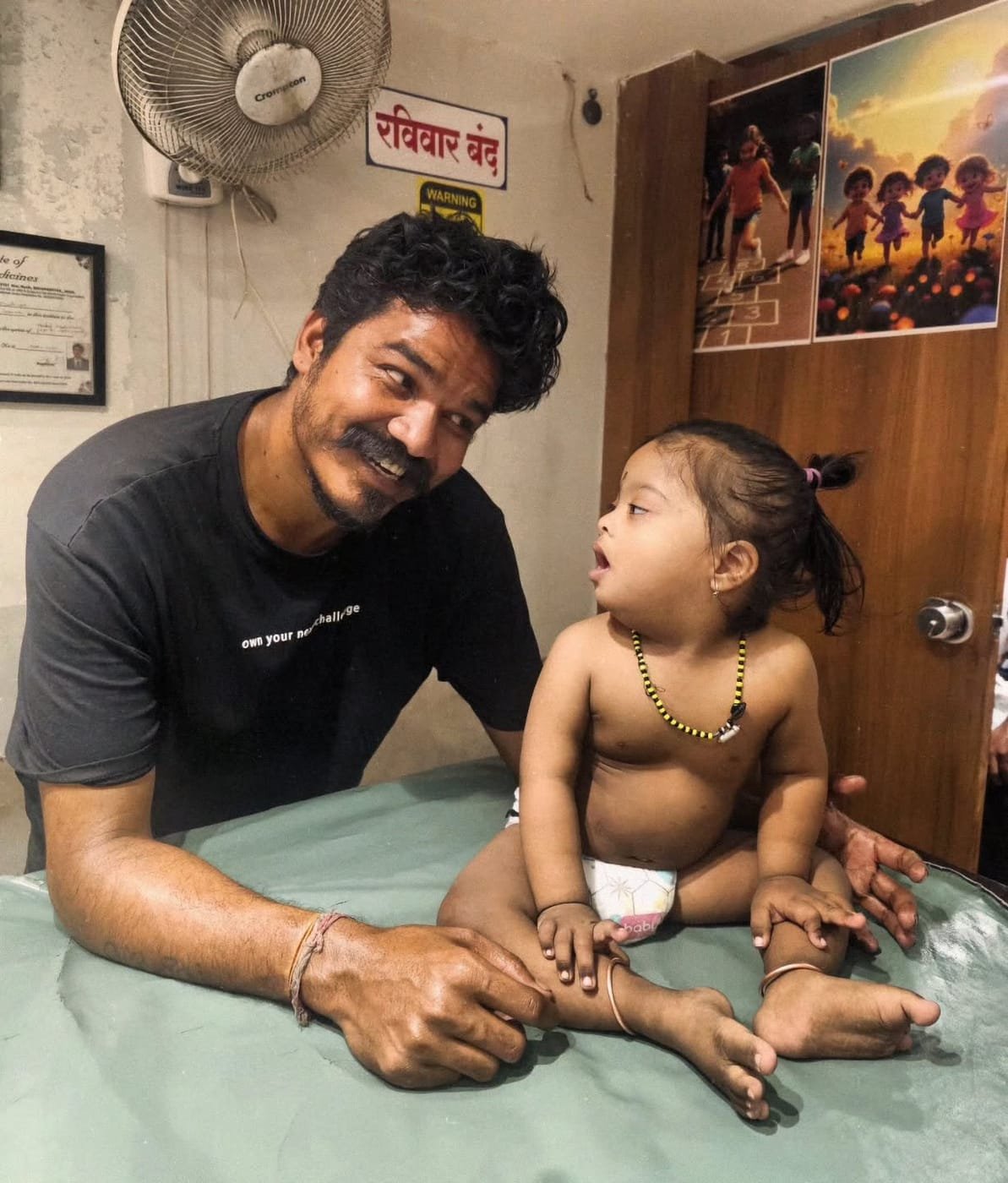 Dr. Ashvin Bhadange during a therapy session with a child